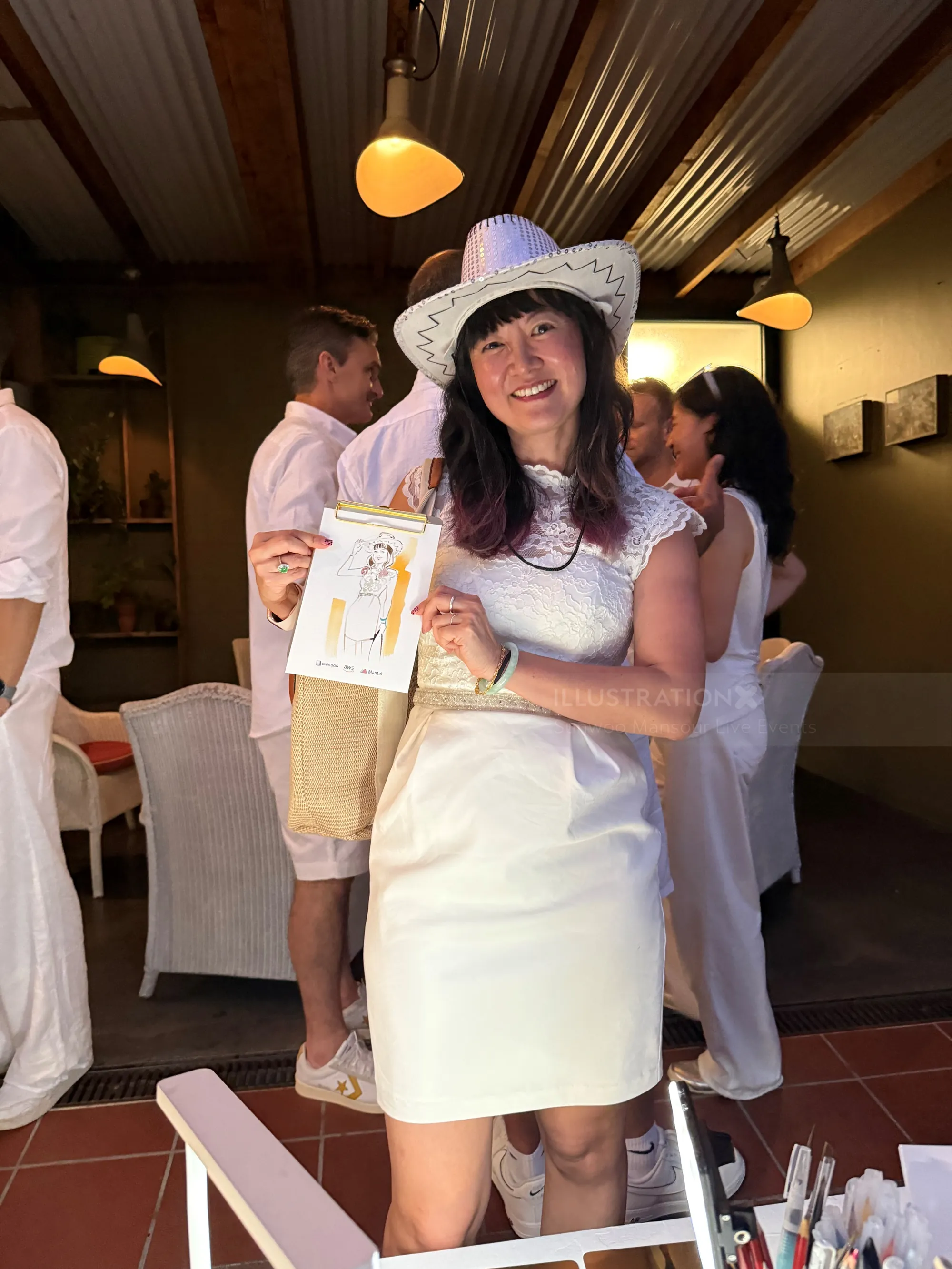 Guest holding illustration at Amazon White Out Party by Sunwoo Mansour