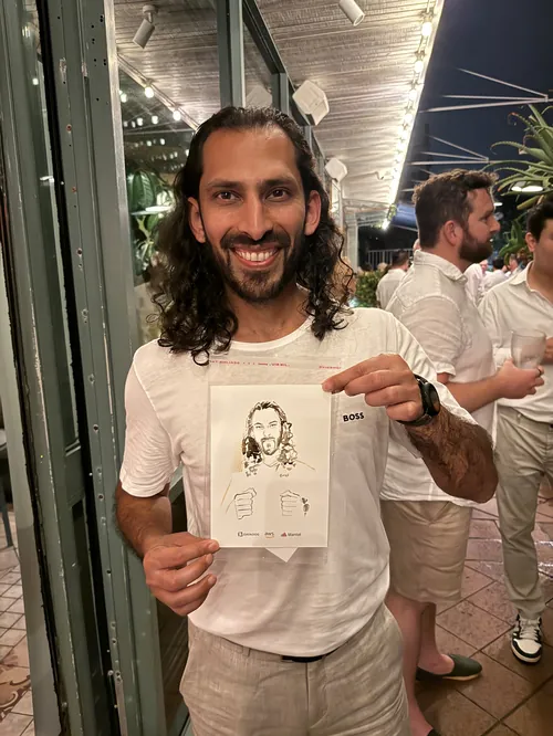 Man holding live guest illustration at Amazon's White Out Party by Sunwoo Mansour