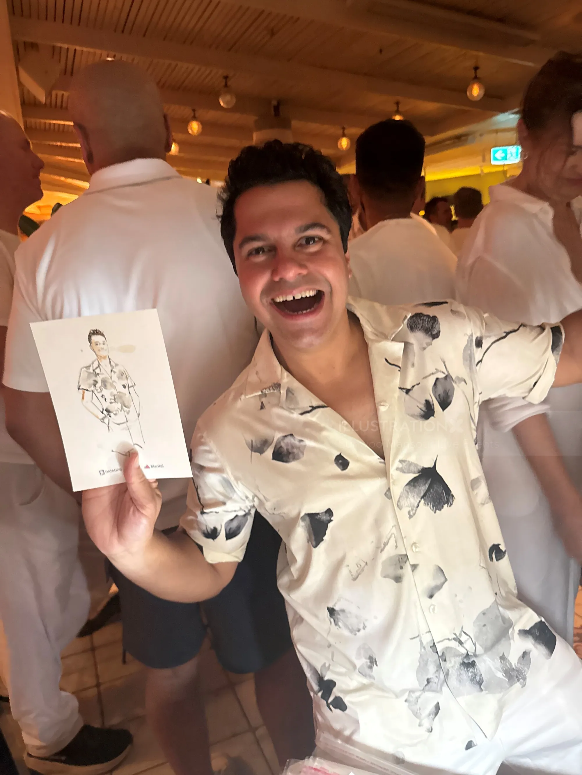 Man smiling holding live event sketch by Sunwoo Mansour