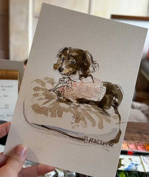 Watercolor painting of a small dog lying on a cushion by Sunwoo Mansour