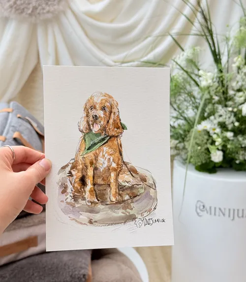 Hand holding a live pet portrait illustration of a dog by Sunwoo Mansour