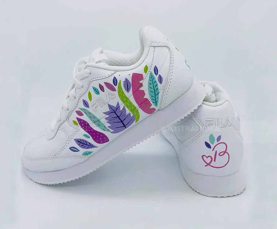 White FILA sneakers decorated with colorful leaves and a butterfly detail by Superama