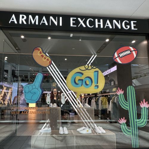 Armani Exchange store window with sports-themed graphics by Superama
