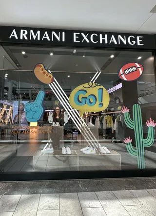 Armani Exchange store window with sports-themed graphics by Superama
