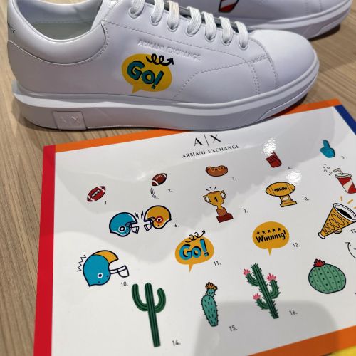 White sneakers with colorful cartoon stickers by Superama