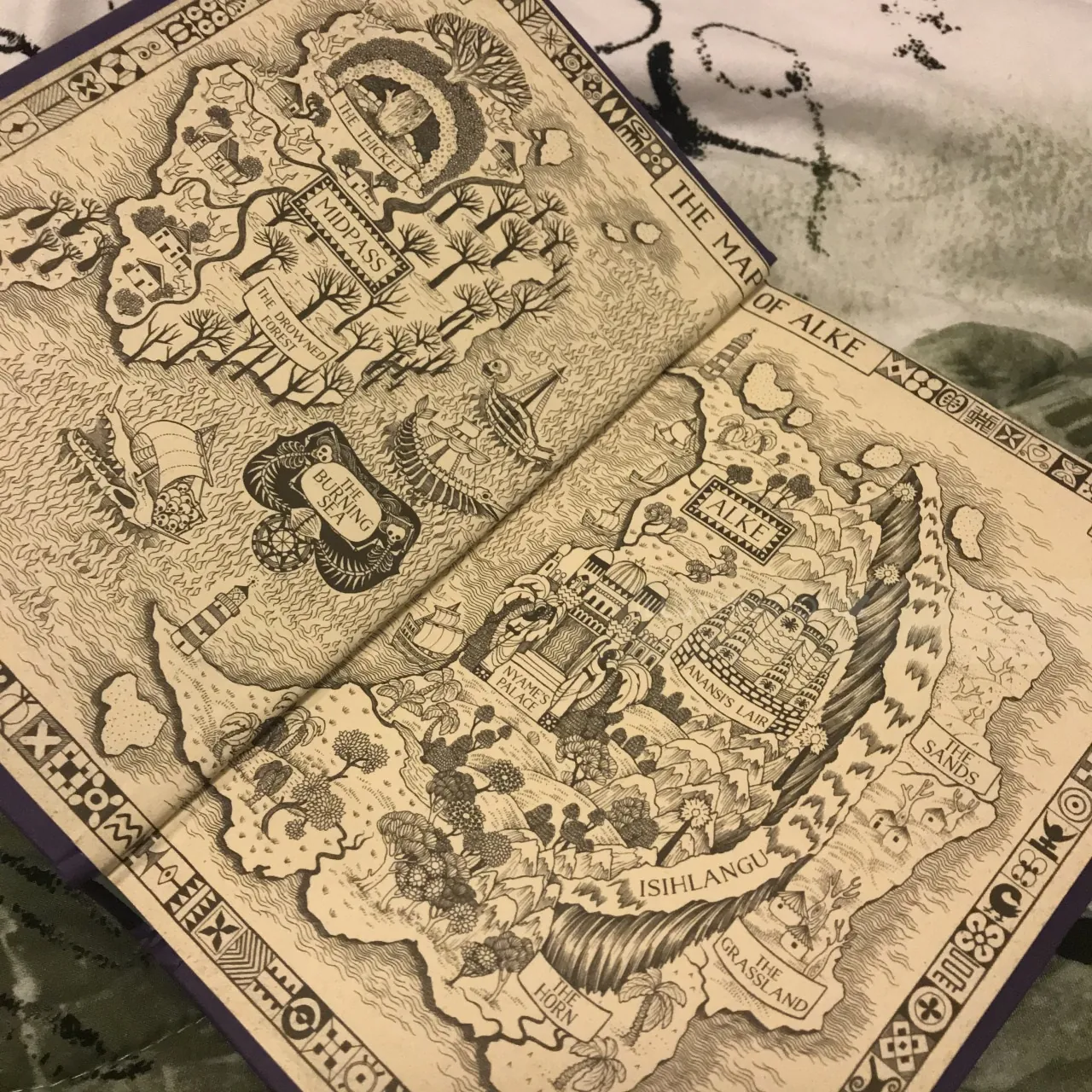 Detailed vintage fantasy map with labeled regions and intricate illustrations