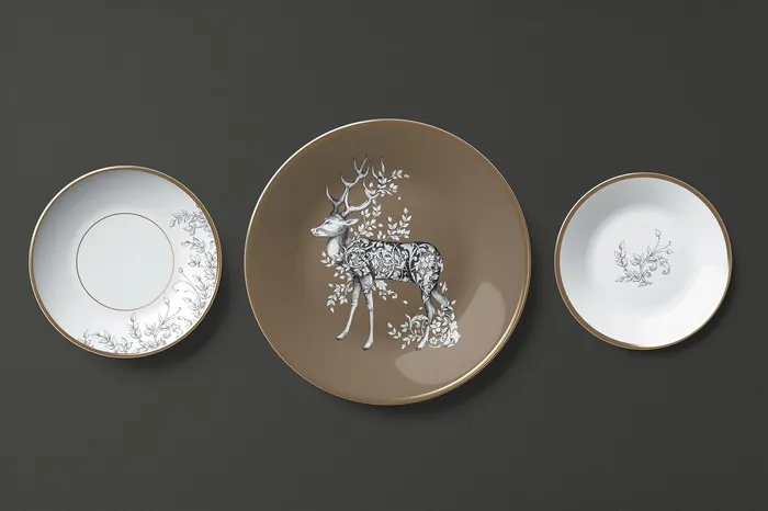 Decorative plates featuring a detailed reindeer illustration by Svetlana Molodchenko