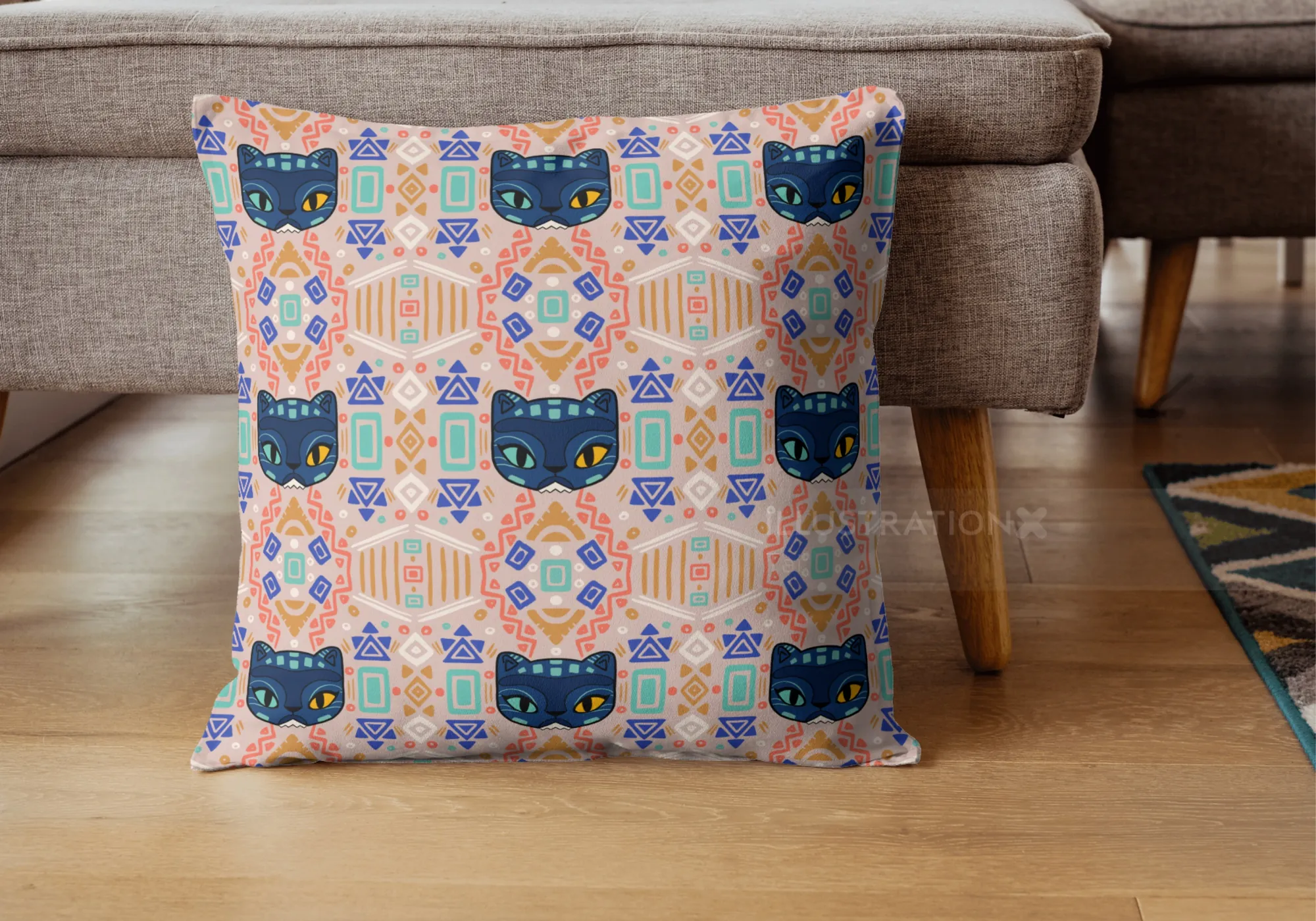 Square pillow with colorful cat faces and geometric designs