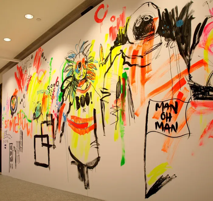 Live event drawing people on wall
