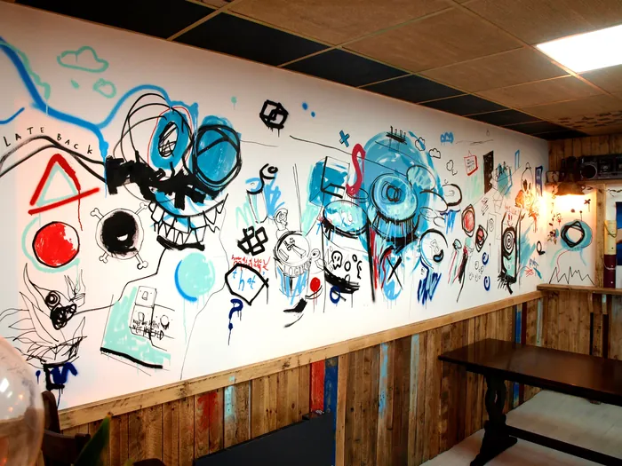 Abstract mural with blue and black sketches in pub interior by Tallon Live Event Drawing