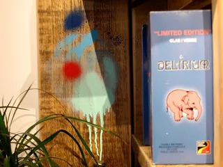 Mural with blue and red shapes and Delirium ale box by Tallon Live Event Drawing