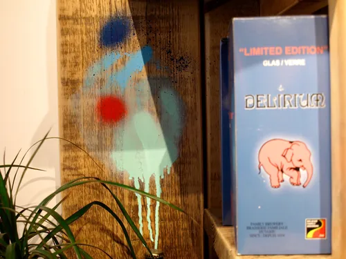 Mural with blue and red shapes and Delirium ale box by Tallon Live Event Drawing