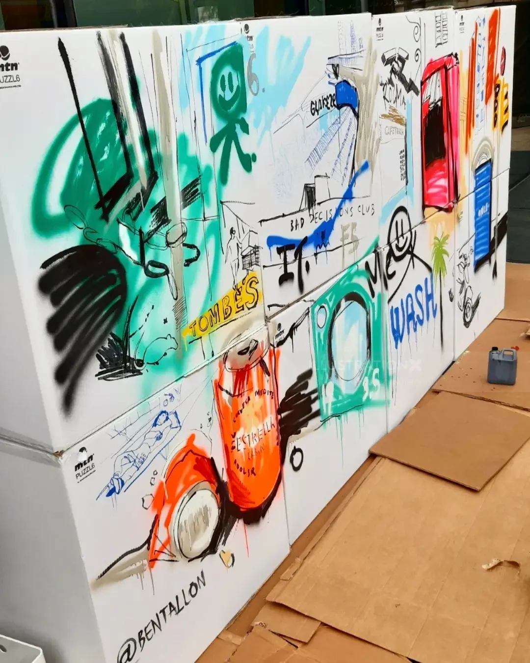 Colorful urban graffiti mural with various illustrations by Tallon Live Event Drawing