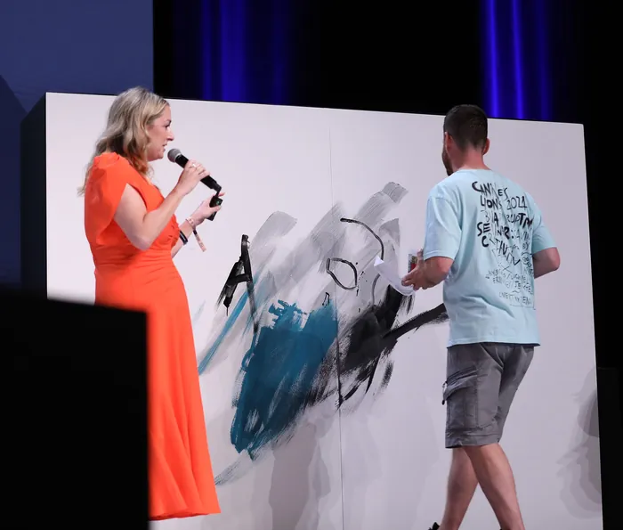 Artist painting live at Cannes Lions creativity seminar