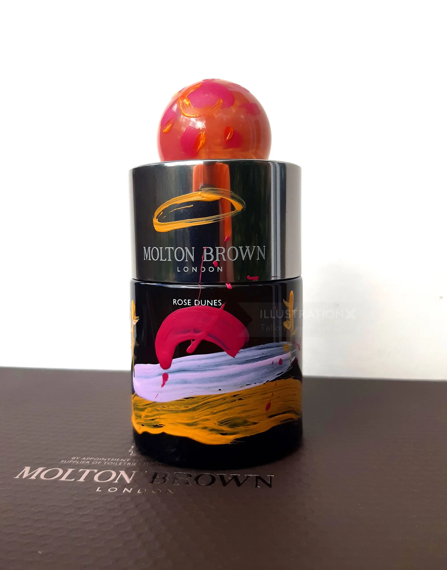 Molton Brown Rose Dunes perfume bottle with red decorative cap