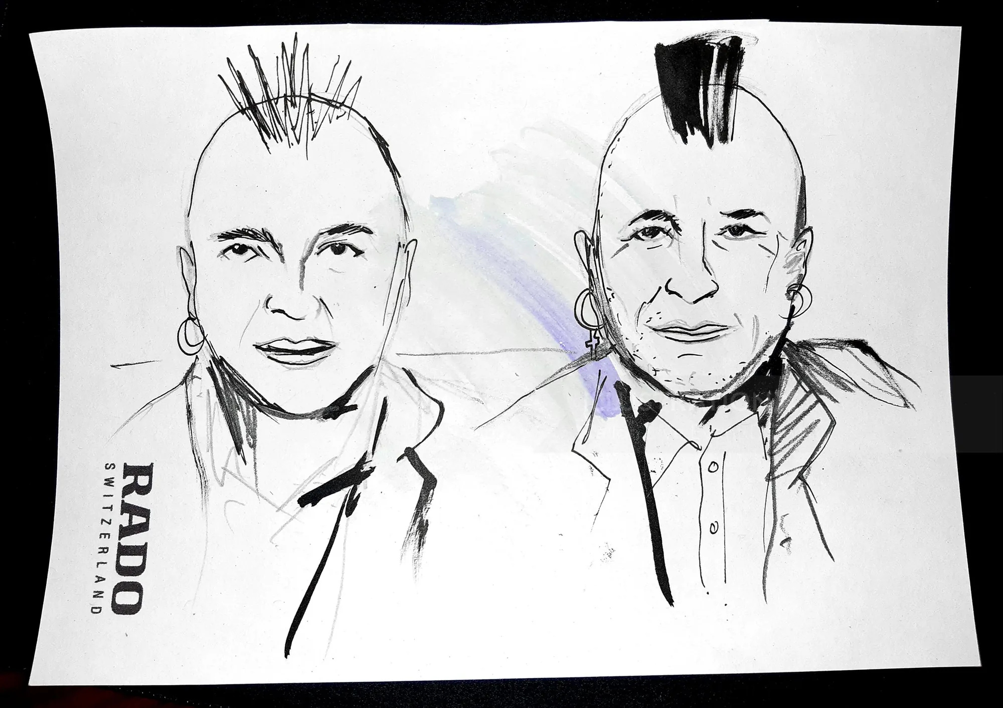 Black ink sketches of two punk-style men with mohawks on white paper