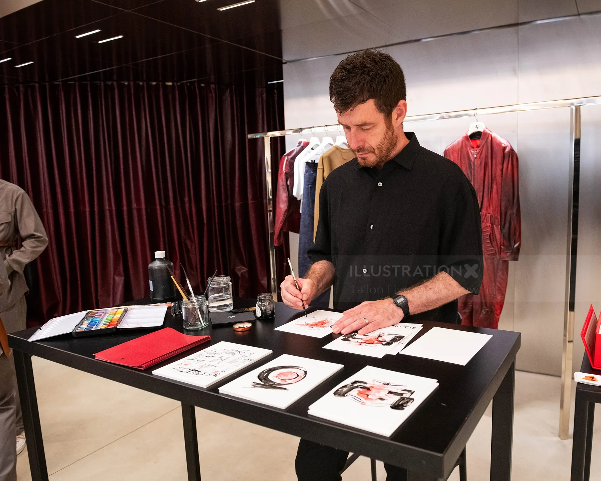 Tallon Live Event Drawing creating artwork at a Ferrari event