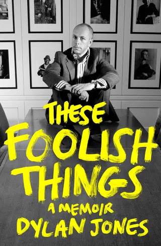 Black and white portrait of a man with yellow memoir title lettering