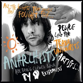 Black and white portrait of a man with graffiti-style text overlay