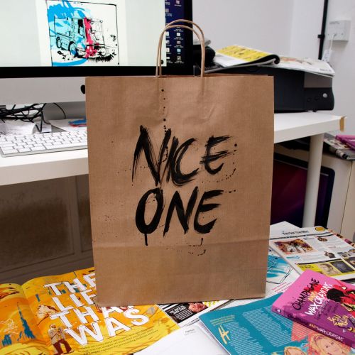 Nice one lettering on carrying bag by Tallon Type