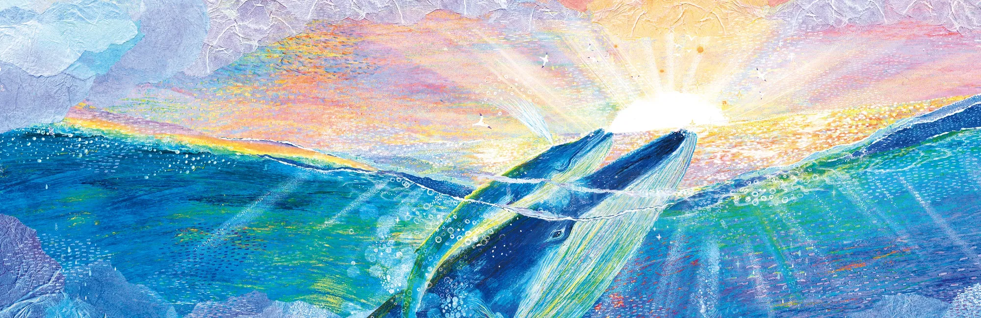 Whale breaking ocean surface under radiant sunlight