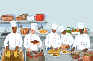 Five chefs preparing various dishes in a professional kitchen
