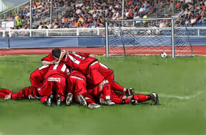 Match de rugby, joueurs avec robe rouge assis sur le sol, herbe verte sur le terrain