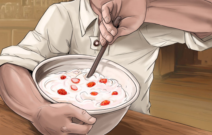 straw berry and milk mixing together, mans hand stirring the container, food preparation