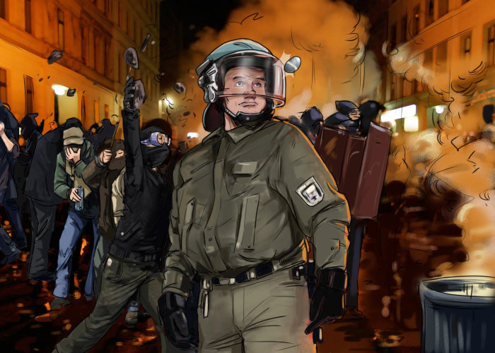 policeman standing with helmet on, people protesting in the background, fire smoke in the background