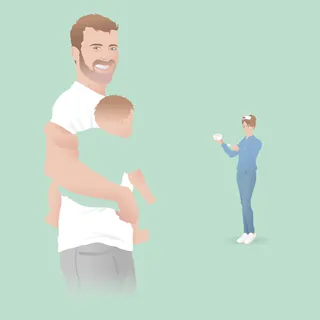 Man holding baby and woman taking picture