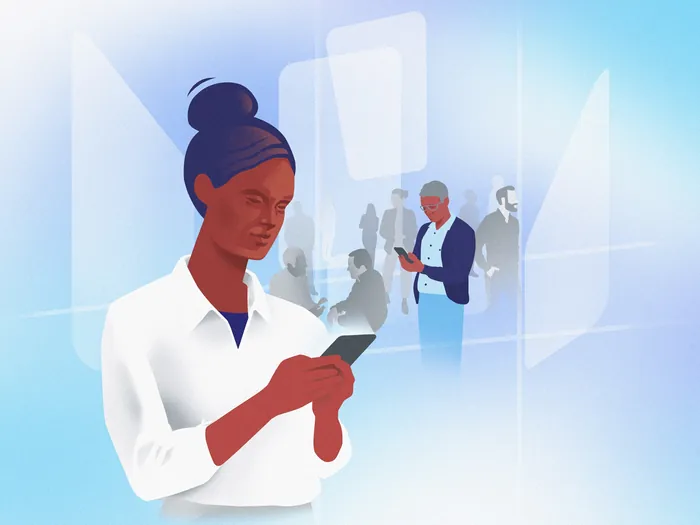 Woman with bun hairstyle looking at smartphone with digital elements