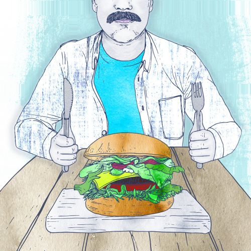 Man with mustache holding utensils ready to eat a big burger