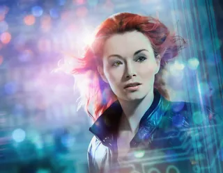 Portrait of a woman with red hair and neon lights by Tom Krieger