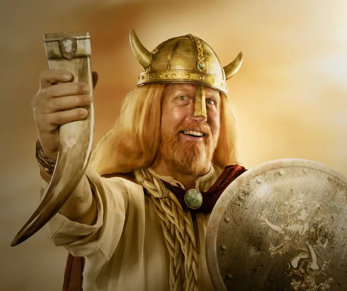 Viking warrior with horned helmet holding a drinking horn and shield by Tom Krieger