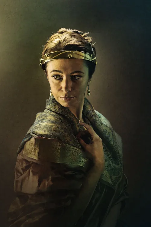 Portrait of a thoughtful woman wearing a headband and draped fabric by Tom Krieger