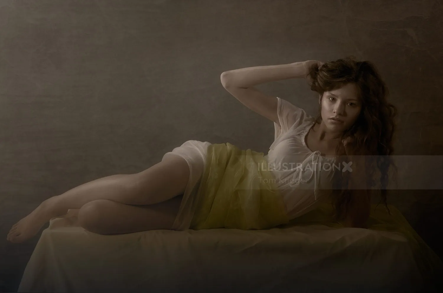 Woman reclining on bed in soft lighting by Tom Krieger