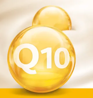 Golden Q10 capsules on white silk fabric by Tom Krieger