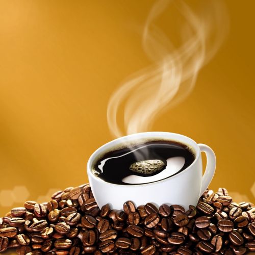 Steaming coffee cup with coffee beans on table by Tom Ungemach