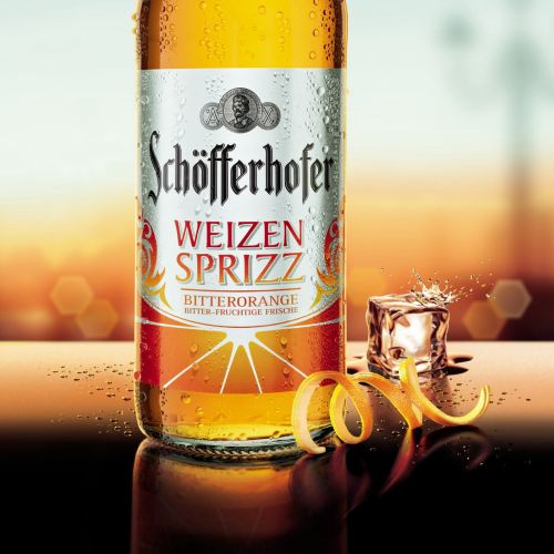 Schöfferhofer Weizen Spritz Bitterorange bottle with ice and orange peel by Tom Ungemach