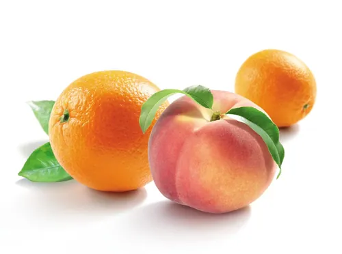 Fresh peach and oranges with green leaves by Tom Ungemach