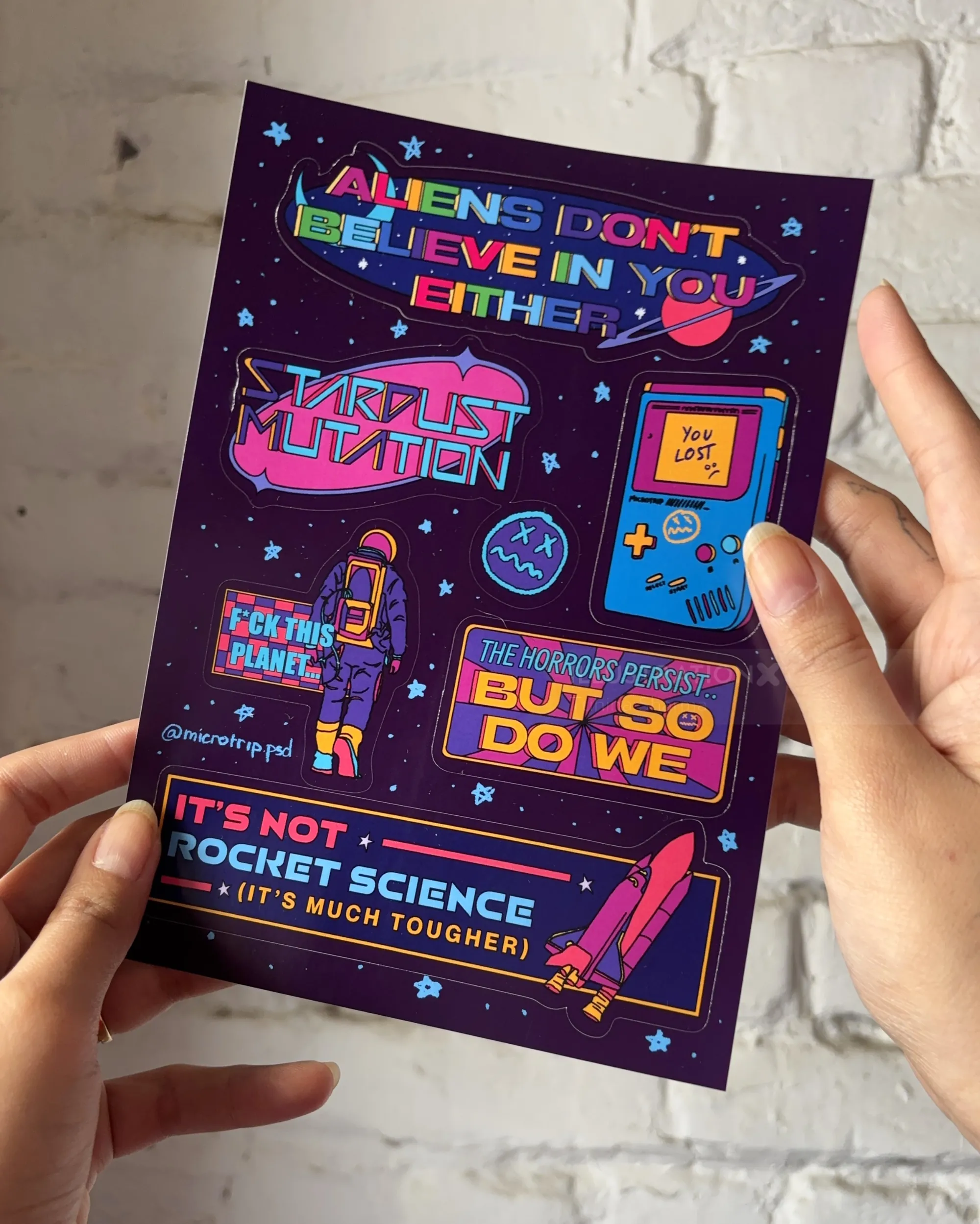 Sci-fi themed sticker sheet with colorful space and alien designs by Tuhina Sharma