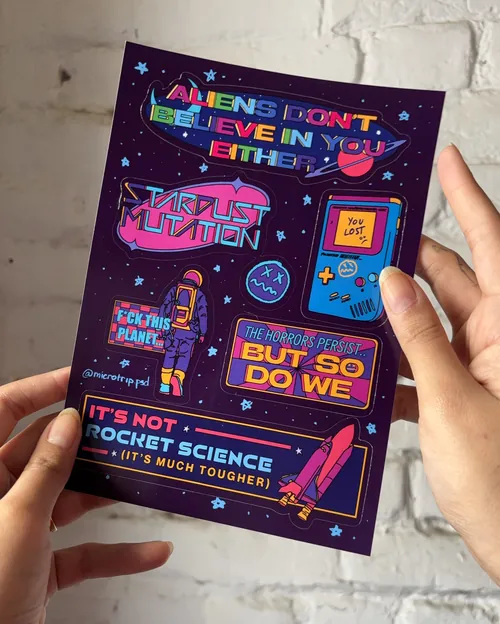 Sci-fi themed sticker sheet with colorful space and alien designs by Tuhina Sharma
