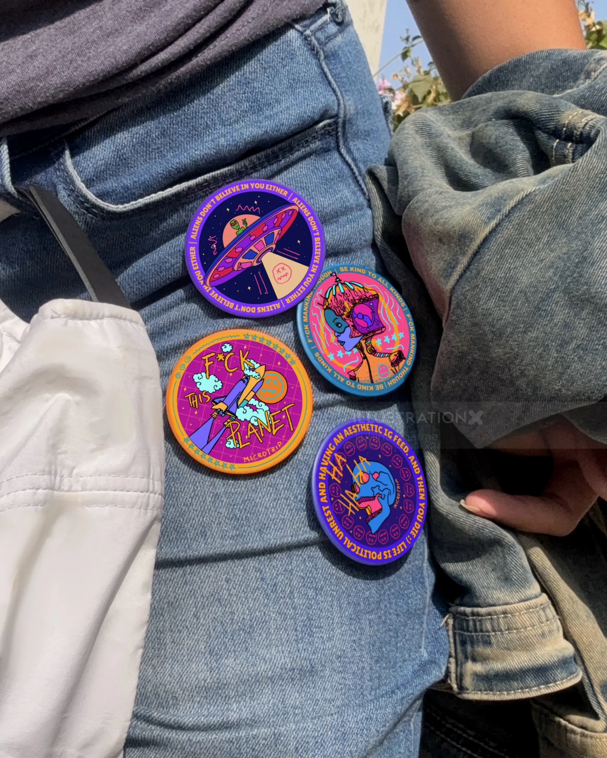 Four colorful embroidered patches on denim by Tuhina Sharma