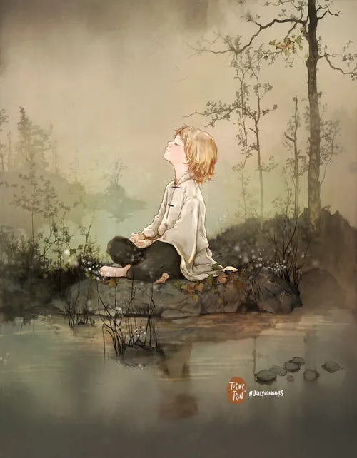 Child sitting cross-legged near calm river with mist and trees in background.