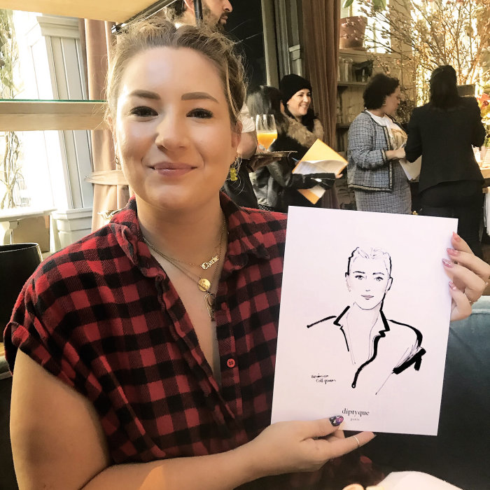 Live Event Drawing woman proudly showing her sketch
