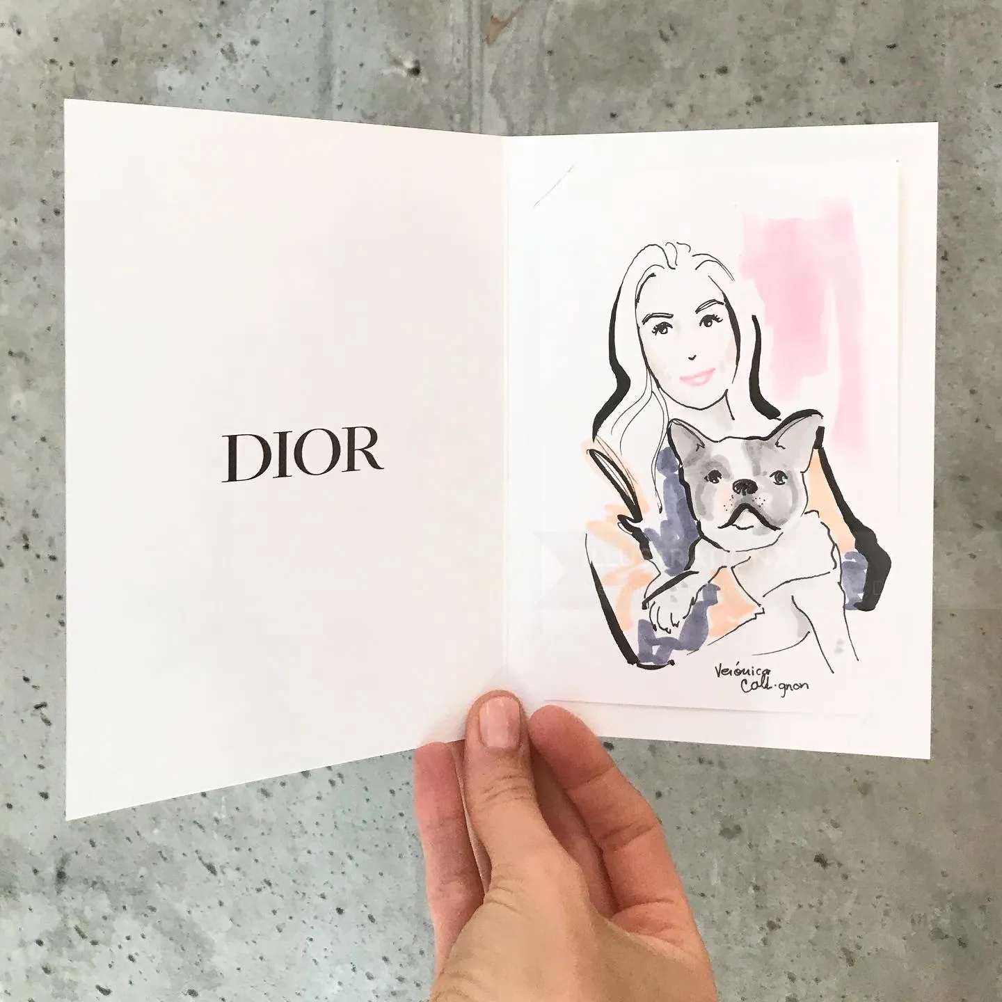 Watercolor illustration of woman holding dog inside Dior card by Veronica Collignon