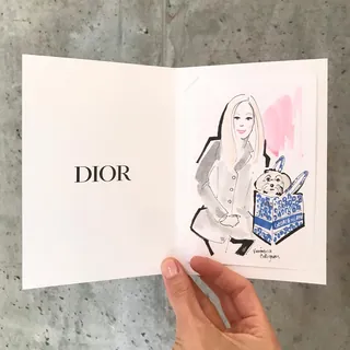 Illustration of woman and dog in Dior card by Veronica Collignon
