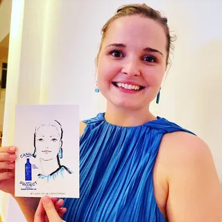 Smiling woman in blue dress holding a sketch portrait, by Veronica Collignon