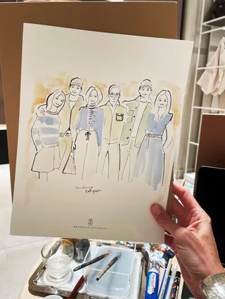 Hand holding fashion illustration of six women wearing casual clothing