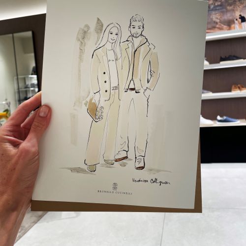 Fashion illustration of a man and woman held in a hand